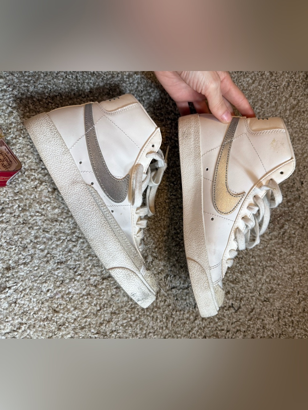 Nike White High-Top Sneakers with Metallic Silver Swoosh